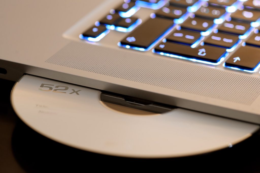 Laptop CD drive representing recent legacy systems