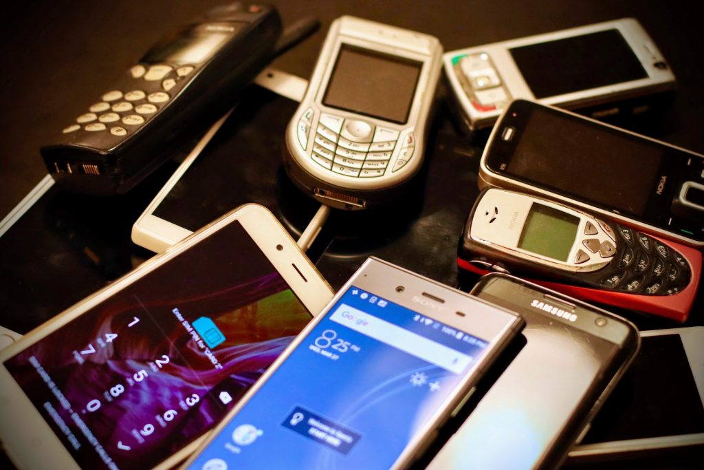 Old mobile phones representing legacy systems