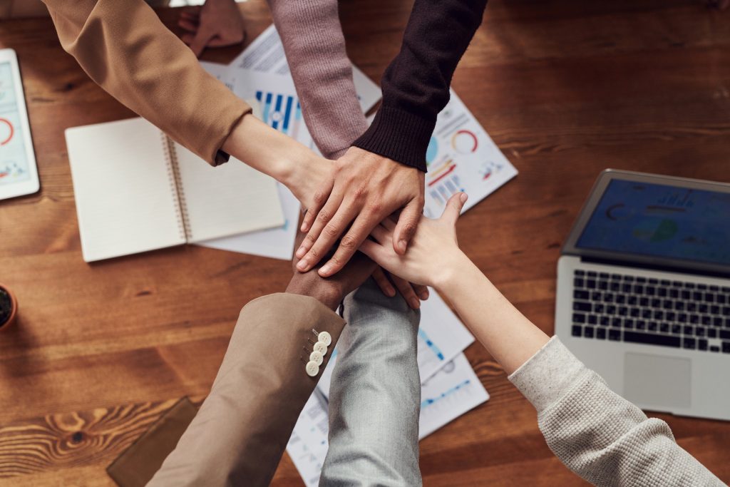 What is the waterfall model? Office team holding hands